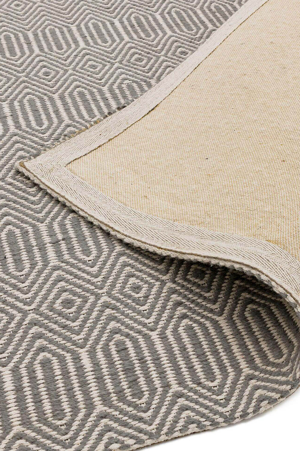 Grey Diamond Rug Folded Showing Reverse - Coates & Warner