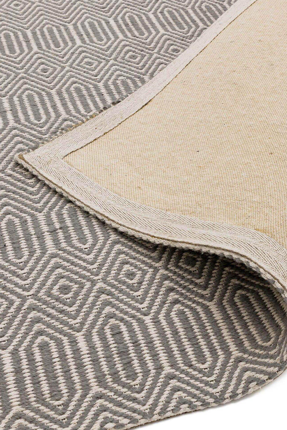 Grey Diamond Rug Folded Showing Reverse - Coates & Warner